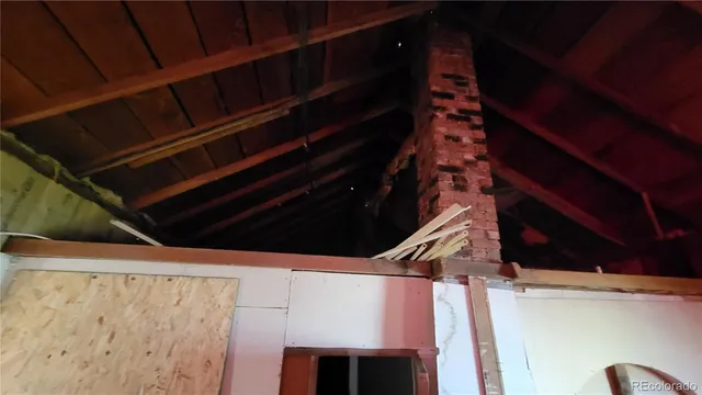 a view of a livingroom with furniture and a window
