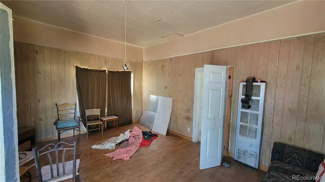 a view of a livingroom with furniture and front door