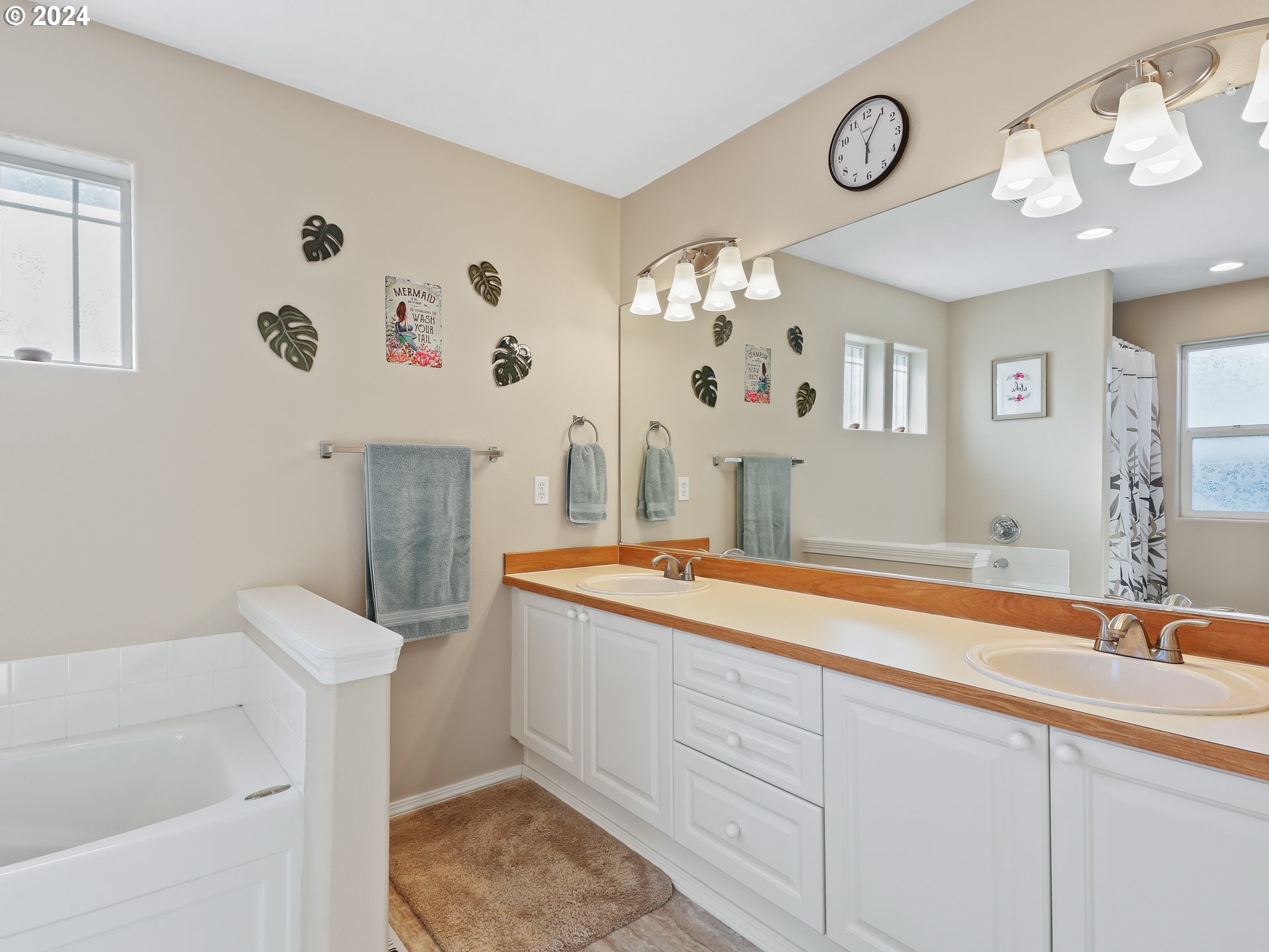 4888 Southeast Antelope Hills Gresham, OR 97080 - Photo 27 of 45 a spacious bathroom with a sink and a mirror