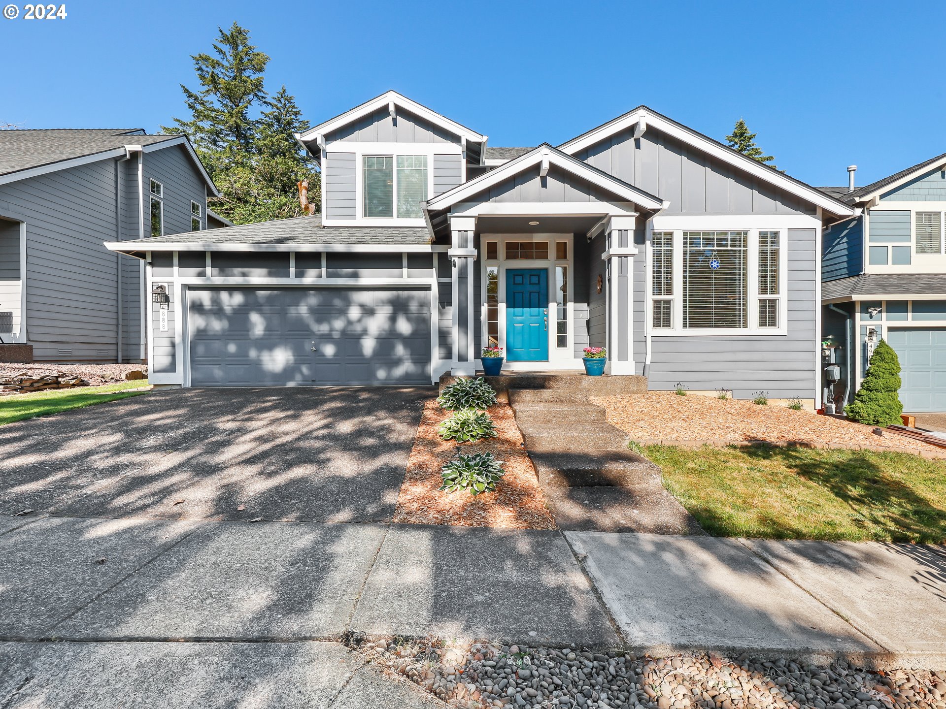 4888 Southeast Antelope Hills Gresham, OR 97080 - Photo 3 of 45 a front view of a house with a yard