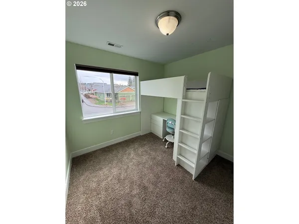 a view of room with stairs and a window