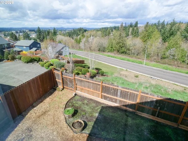a view of a garden with an outdoor seating