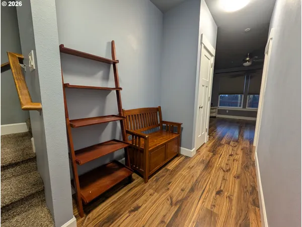 a living room with a bed furniture and a window