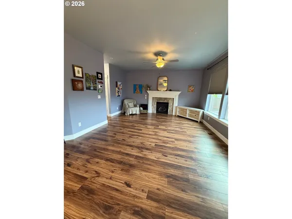 a view of a livingroom with furniture and a workspace