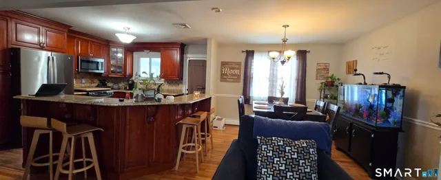 a kitchen with a refrigerator and a stove