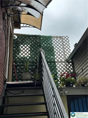 a view of a backyard with wooden stairs