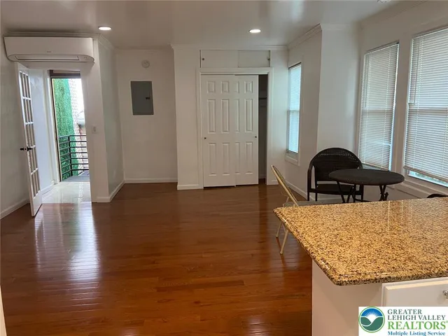 a view of a room with furniture window and wooden floor