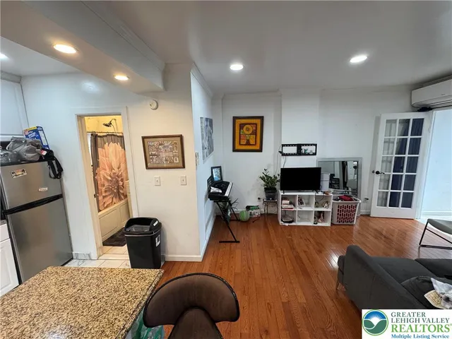 a large kitchen with stainless steel appliances granite countertop a stove and a sink