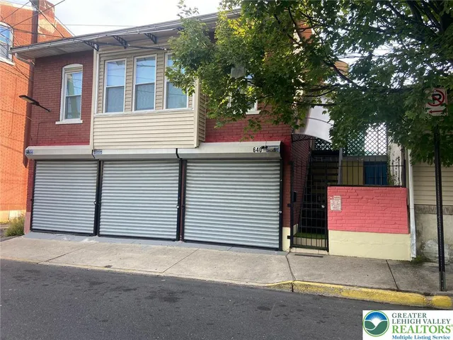 a front view of a house with a garage