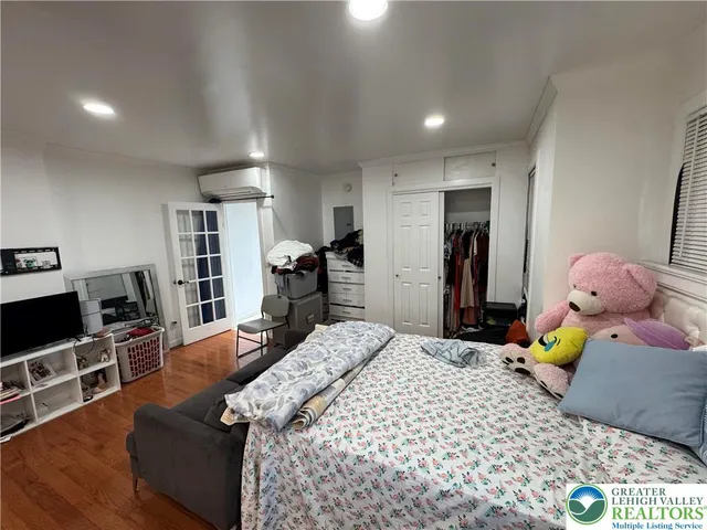 a kitchen with stainless steel appliances granite countertop sink stove refrigerator and cabinets