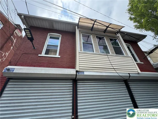 a view of a house with a garage