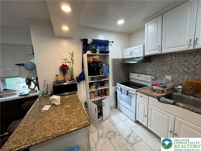 a view of outdoor space with deck and flat screen tv