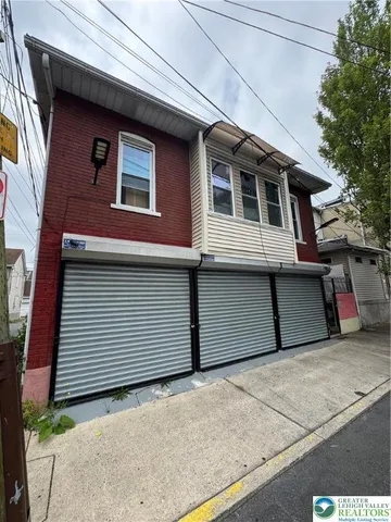 a front view of a house with garage