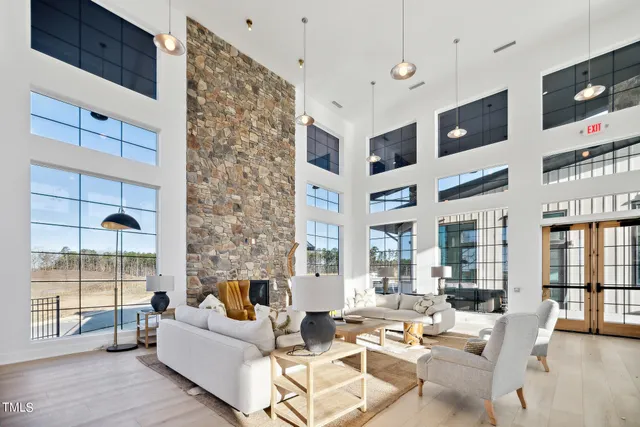 a living room with fireplace furniture and a flat screen tv