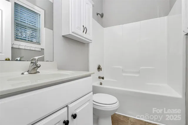 a bathroom with a sink a toilet and a bathtub