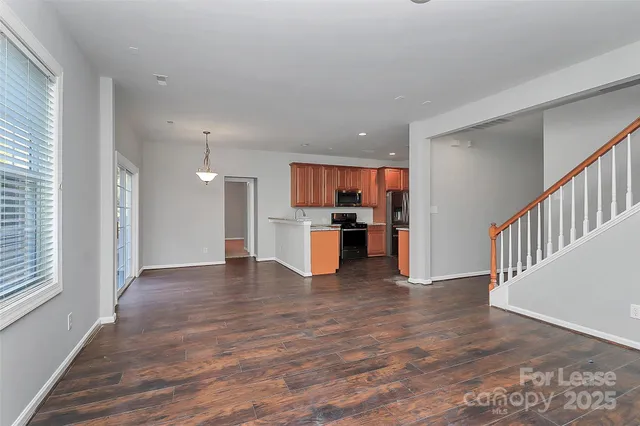 a view of kitchen with wooden floor