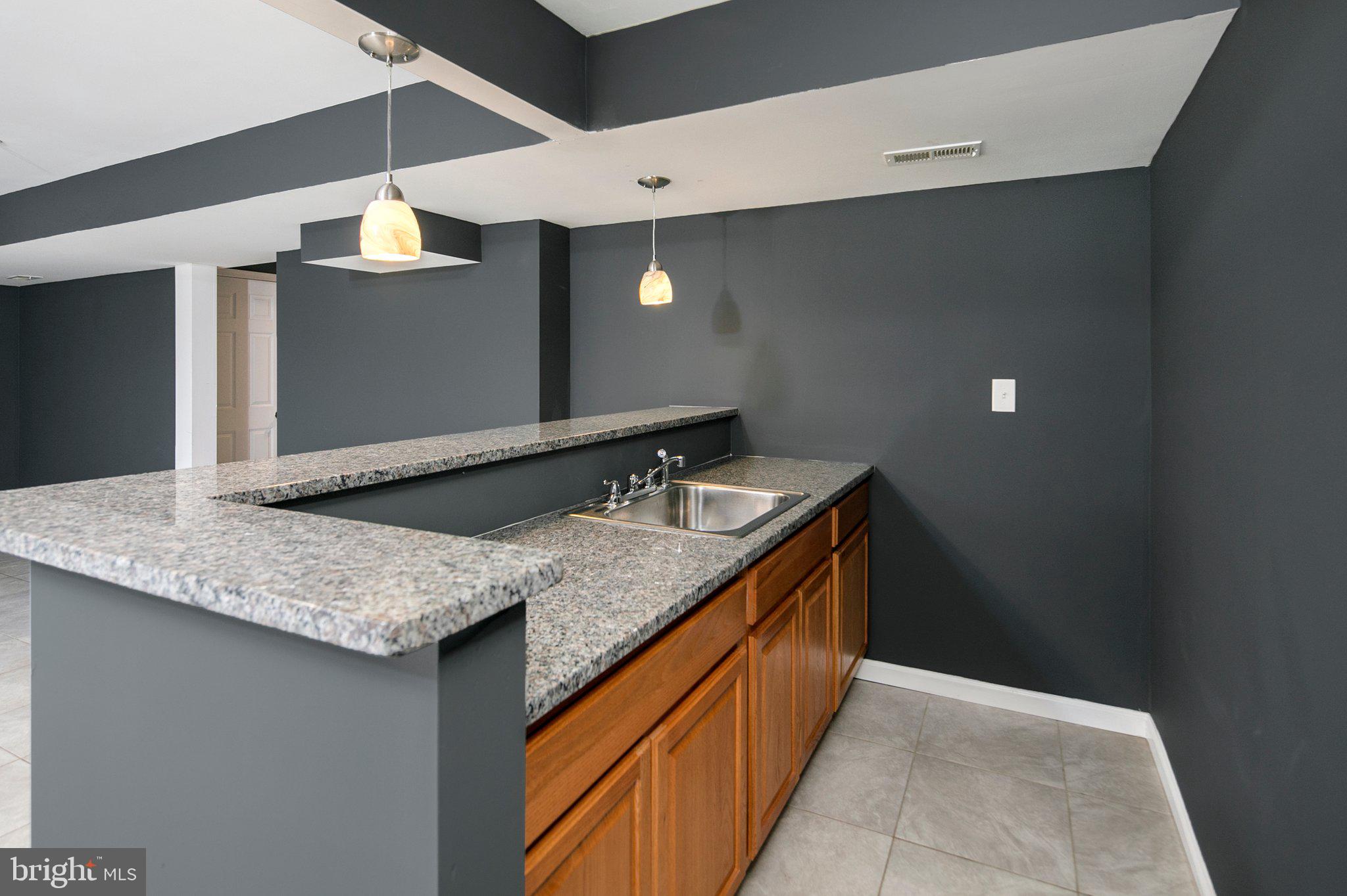 1643 A Shookstown Road Frederick, MD 21702 - Photo 31 of 41 Wet bar in basement