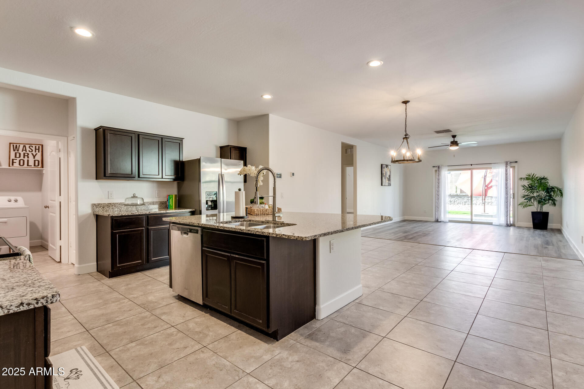 4750 East Chromium Road San Tan Valley, AZ 85143 - Photo 42 of 74 a large kitchen with stainless steel appliances granite countertop a stove and a sink