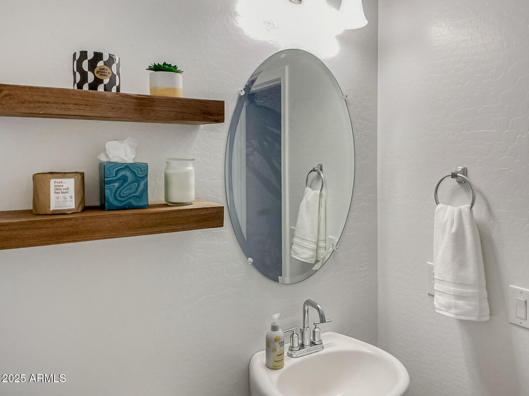 4750 East Chromium Road San Tan Valley, AZ 85143 - Photo 53 of 74 a bathroom with a sink and a mirror