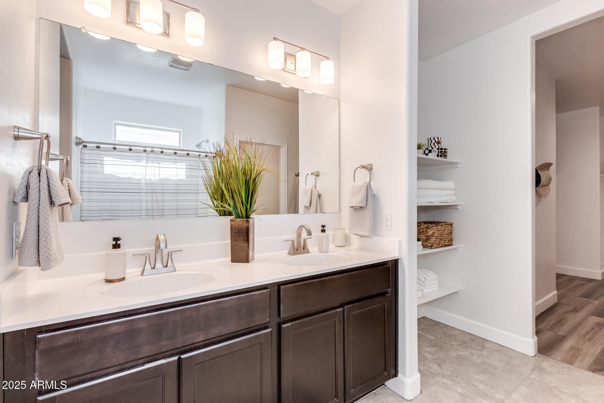 4750 East Chromium Road San Tan Valley, AZ 85143 - Photo 9 of 74 a bathroom with a sink and a mirror