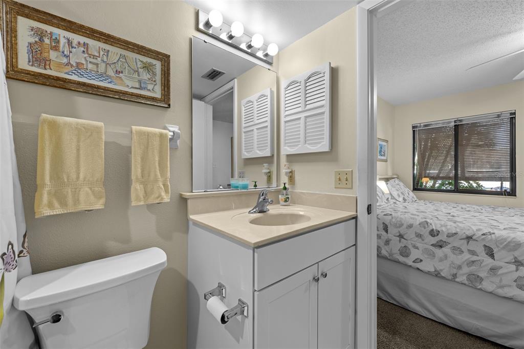 5290 Willow Links, Unit 57 Sarasota, FL 34235 - Photo 11 of 46 a bathroom with a sink a toilet and a mirror