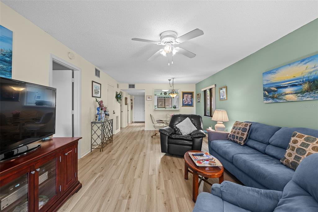 5290 Willow Links, Unit 57 Sarasota, FL 34235 - Photo 14 of 46 a living room with furniture and a flat screen tv