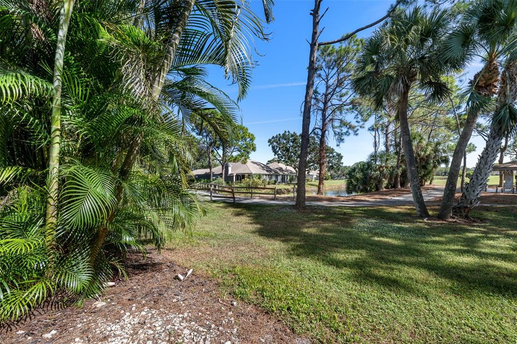 5290 Willow Links, Unit 57 Sarasota, FL 34235 - Photo 24 of 46 a view of a park with large trees