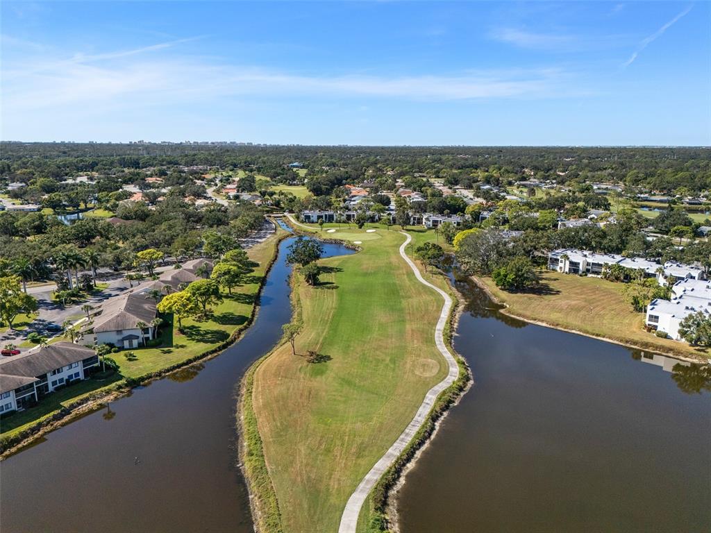 5290 Willow Links, Unit 57 Sarasota, FL 34235 - Photo 41 of 46 an aerial view of a house with a lake view