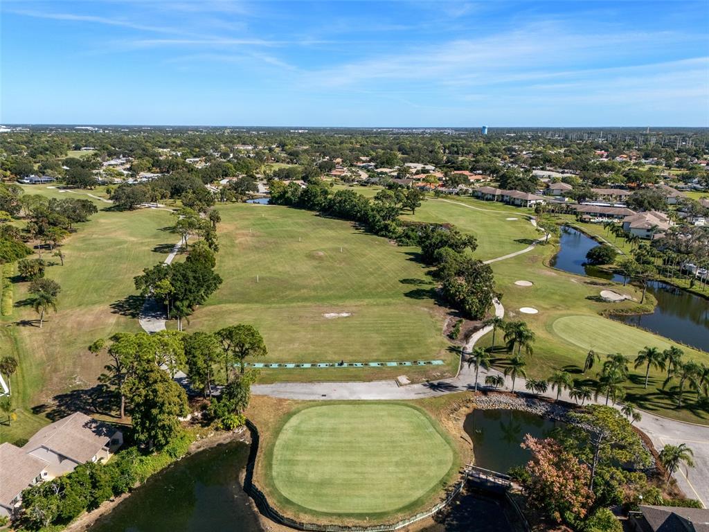 5290 Willow Links, Unit 57 Sarasota, FL 34235 - Photo 42 of 46 an aerial view of residential houses with outdoor space