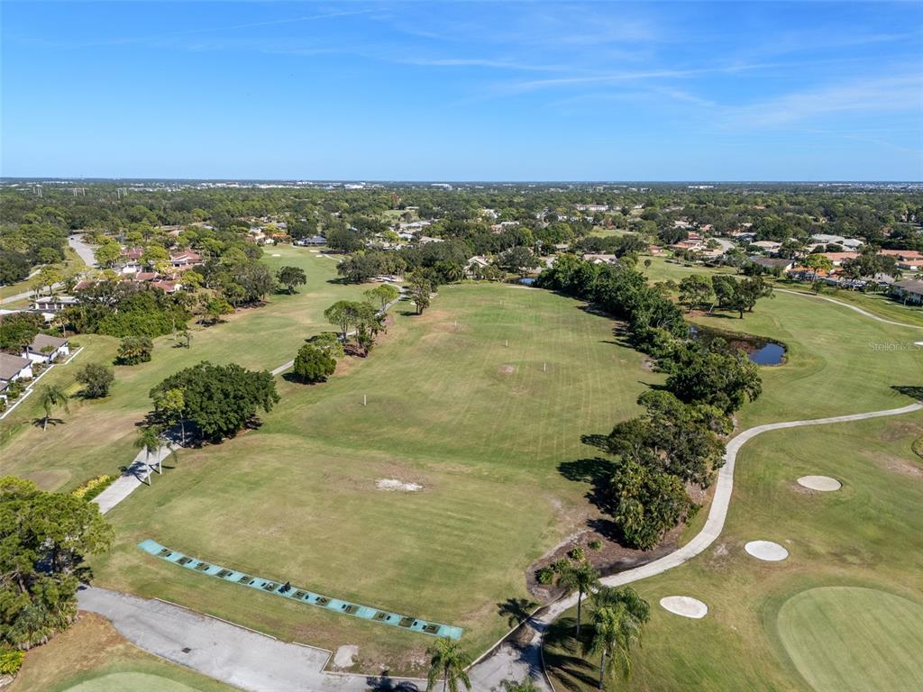 5290 Willow Links, Unit 57 Sarasota, FL 34235 - Photo 43 of 46 an aerial view of residential houses with outdoor space