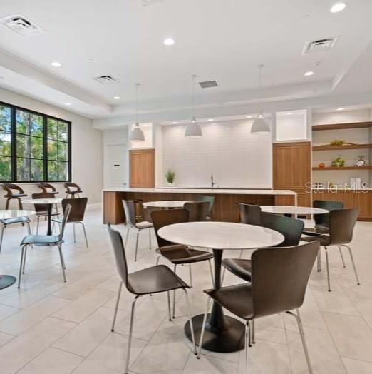 5290 Willow Links, Unit 57 Sarasota, FL 34235 - Photo 44 of 46 a view of a dining room with furniture