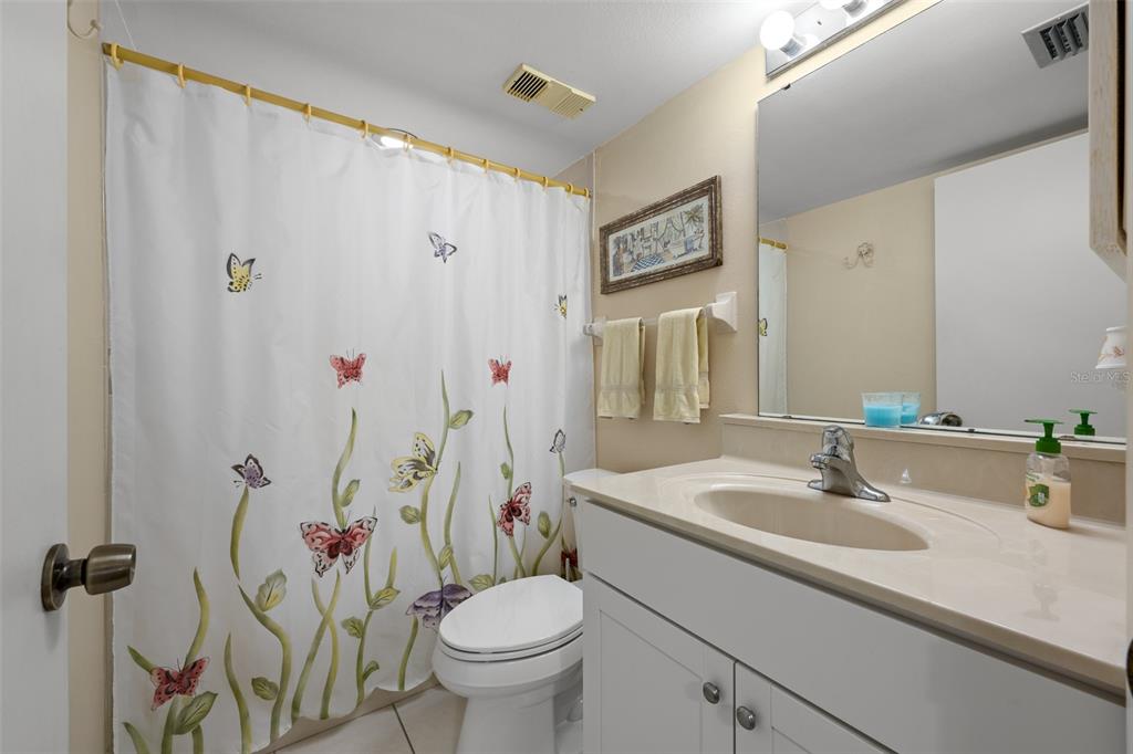 5290 Willow Links, Unit 57 Sarasota, FL 34235 - Photo 10 of 46 a bathroom with a sink toilet and shower