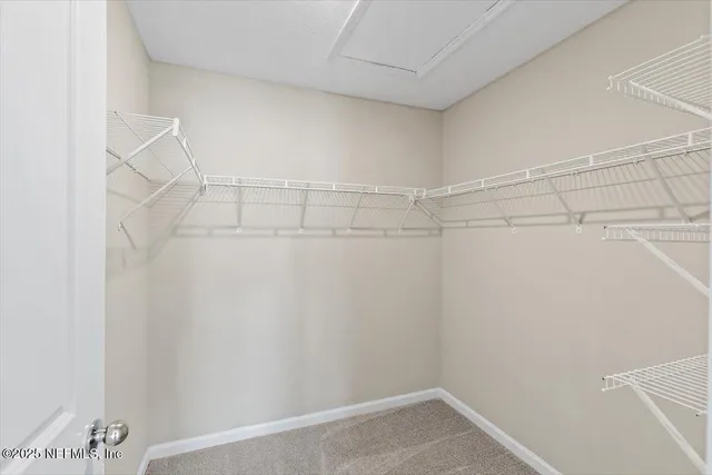 a view of a room with racks on the wall