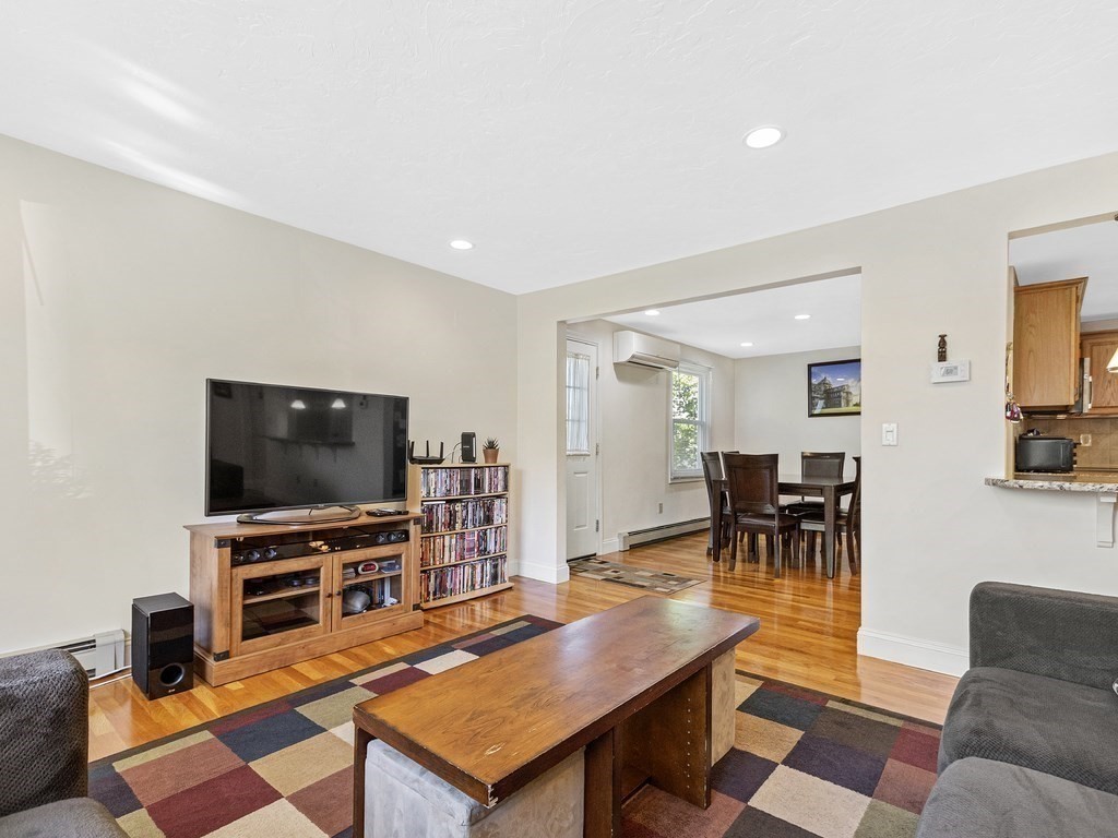 17 Central Street, Unit 2 Waltham, MA 02453 - Photo 14 of 39 a living room with furniture and a flat screen tv