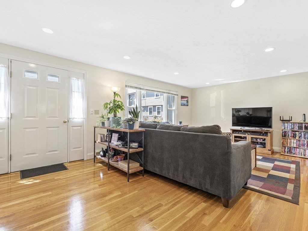 17 Central Street, Unit 2 Waltham, MA 02453 - Photo 15 of 39 a living room with furniture and a flat screen tv
