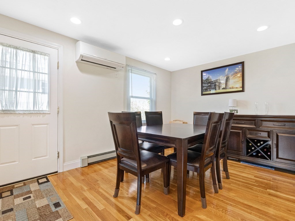 17 Central Street, Unit 2 Waltham, MA 02453 - Photo 16 of 39 a view of a dining room with furniture and wooden floor