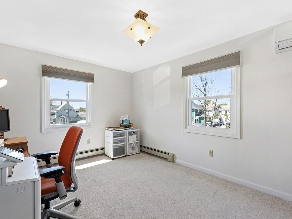 17 Central Street, Unit 2 Waltham, MA 02453 - Photo 25 of 39 a room with furniture and a window