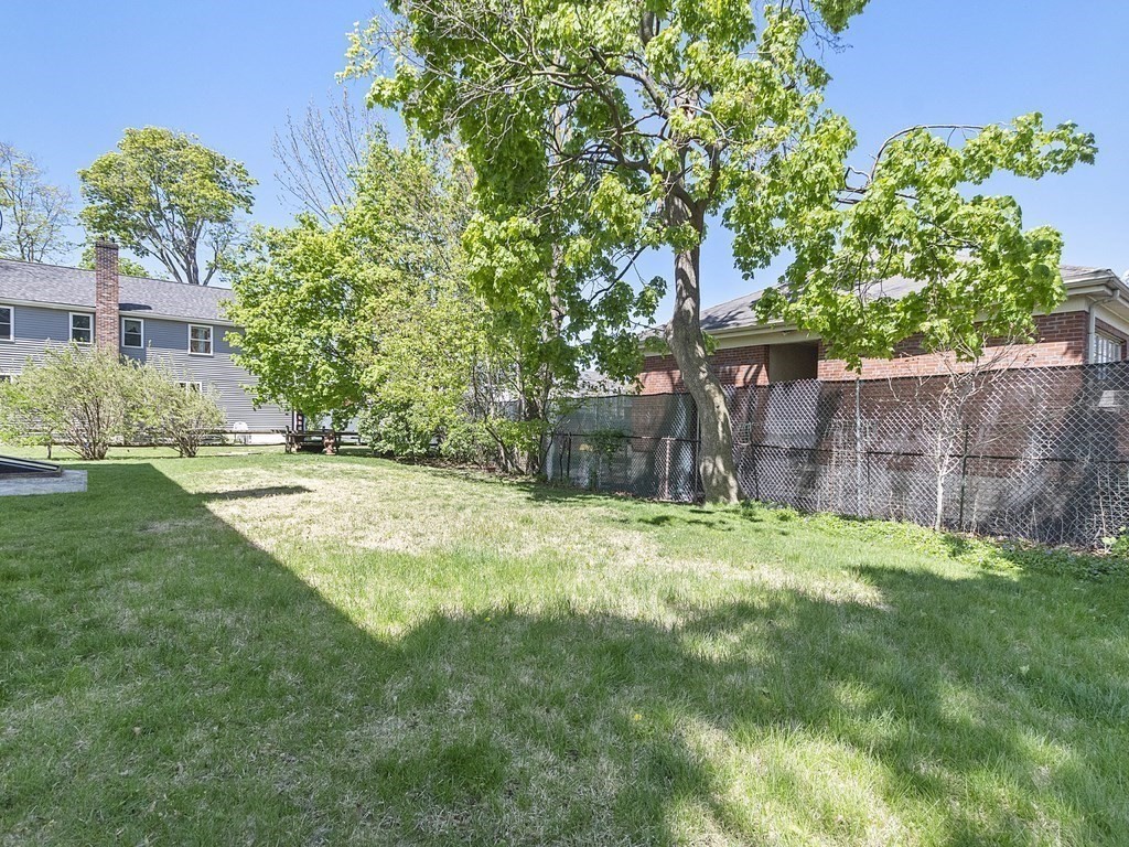 17 Central Street, Unit 2 Waltham, MA 02453 - Photo 32 of 39 front view of a house with a yard