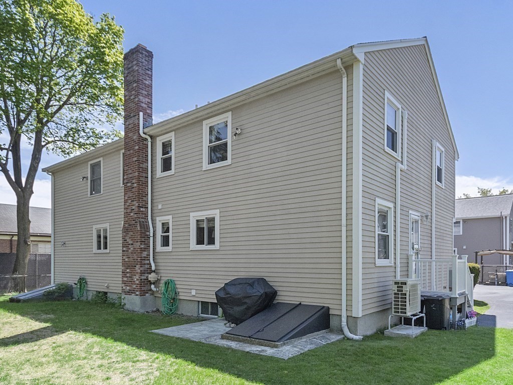 17 Central Street, Unit 2 Waltham, MA 02453 - Photo 34 of 39 a front view of a house with a garden