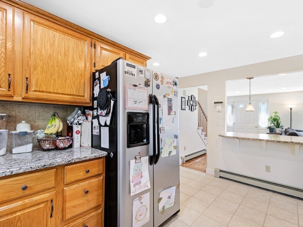 17 Central Street, Unit 2 Waltham, MA 02453 - Photo 6 of 39 a kitchen with stainless steel appliances granite countertop a refrigerator and cabinets