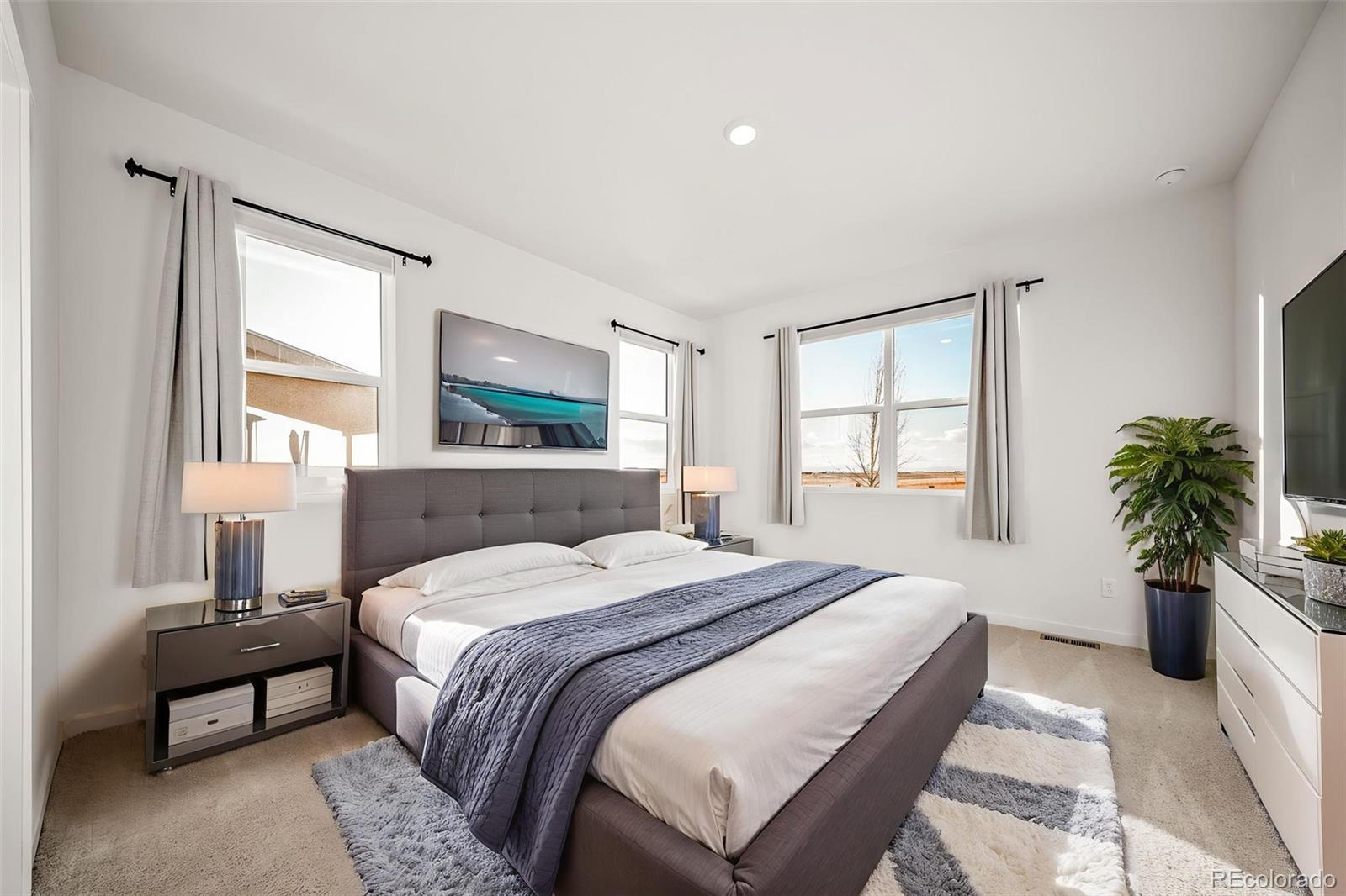 3018 Belleville Ridge Road Elizabeth, CO 80107 - Photo 15 of 32 a bedroom with a bed and a large window