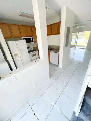 a view of a kitchen with a sink
