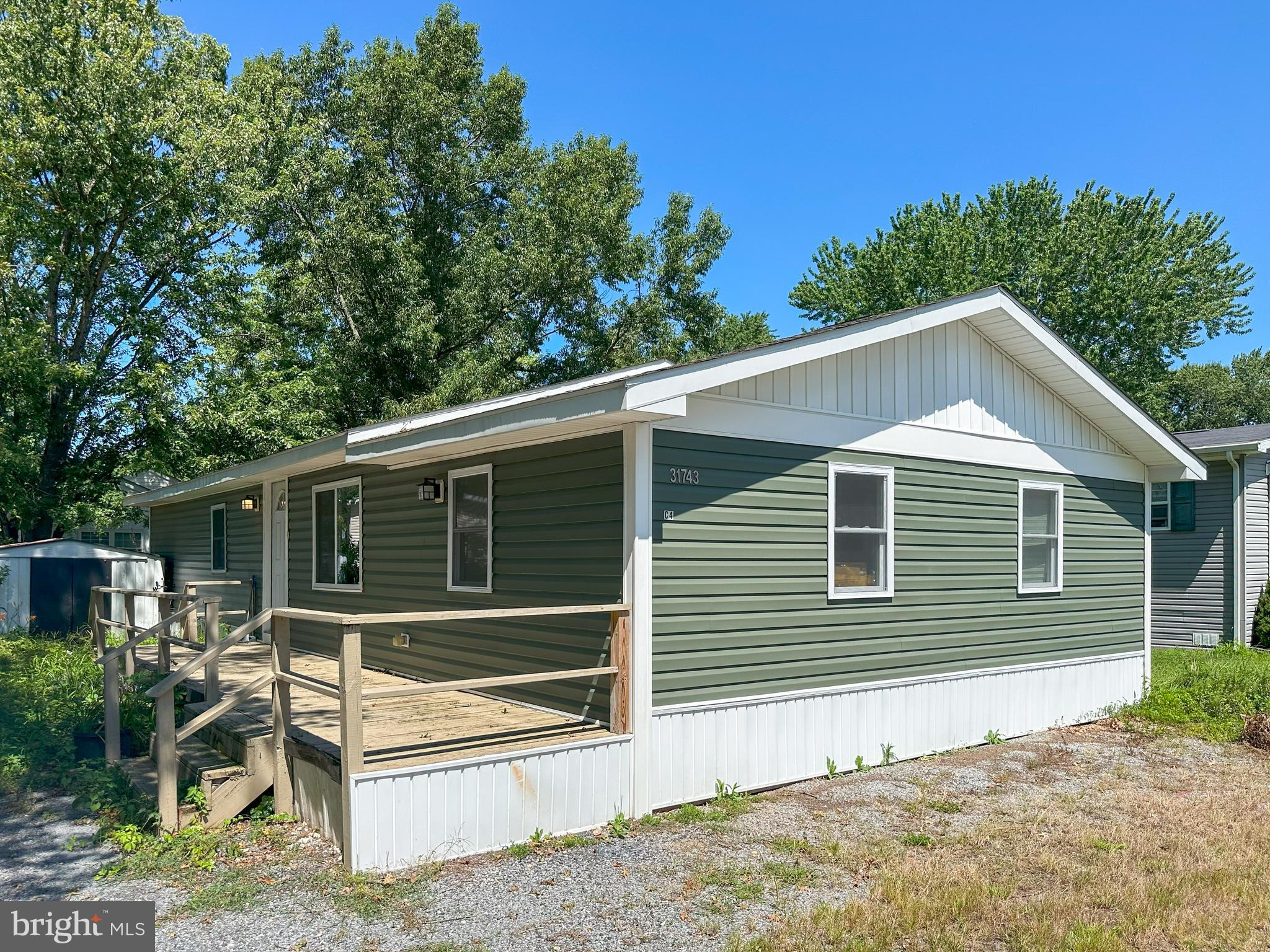 31743 Siham Road Lewes, DE 19958 - Photo 1 of 12 a view of house with a small yard and a large window