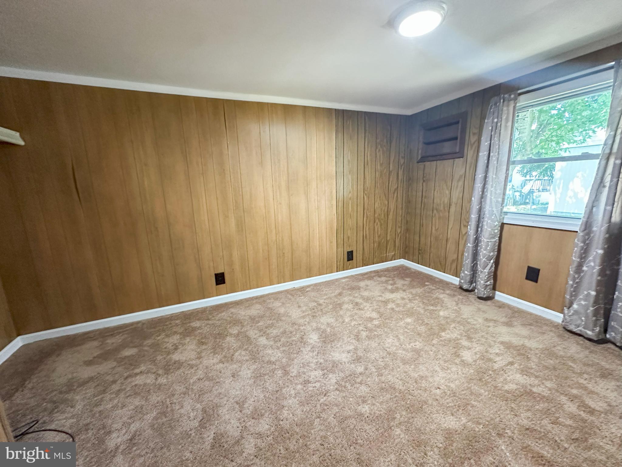 31743 Siham Road Lewes, DE 19958 - Photo 8 of 12 a view of an empty room with a window