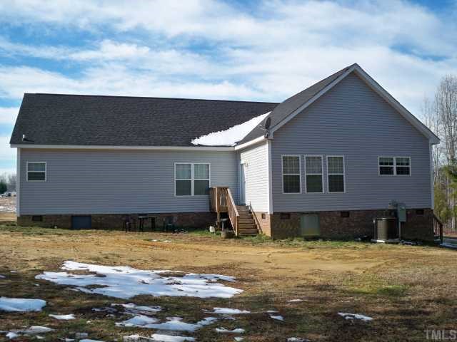 208 W Road Angier, NC 27501 - Photo 2 of 6 a view of a house with backyard and swimming pool