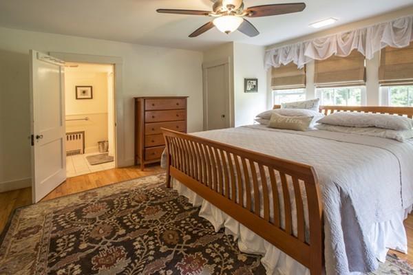 52 Amherst Road Pelham, MA 01002 - Photo 16 of 42 a bedroom with a bed and a window