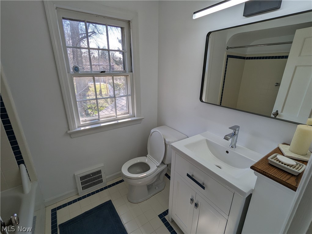 1050 Renfield Road Cleveland Heights, OH 44121 - Photo 21 of 41 Full bathroom with toilet, tile flooring, oversized vanity, and a wealth of natural light