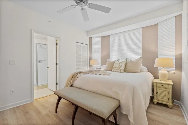 a bedroom with a bed and a table