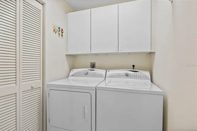 a utility room with dryer and washer