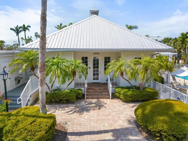 a living room with lots of furniture with wooden floor